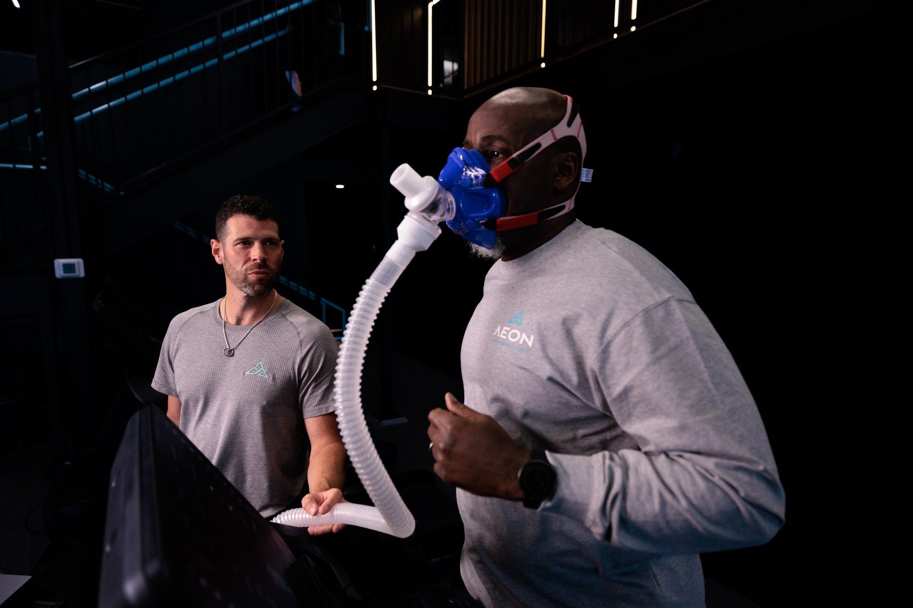 A member completing a VO2 assessment with an Aeon coach as part of the advanced services tier in Alpharetta