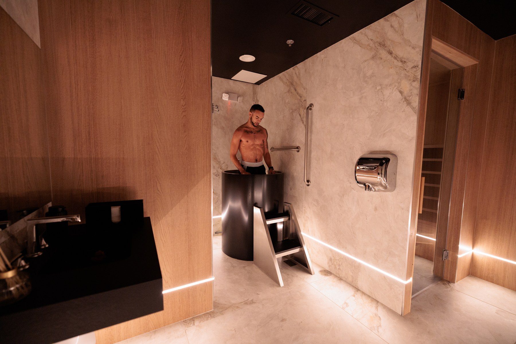 The cold plunge and infrared sauna recovery area at Aeon Wellness Club