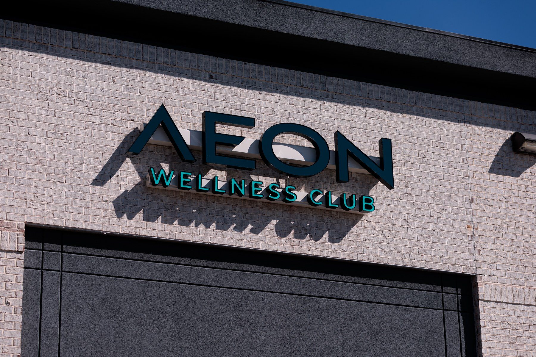 The Aeon Wellness Club sign at the entrance to the studio on McFarland Parkway in Alpharetta